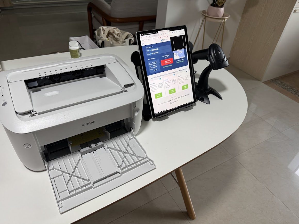 Compact onsite registration setup with badge printer, tablet registration dashboard and QR code scanner
