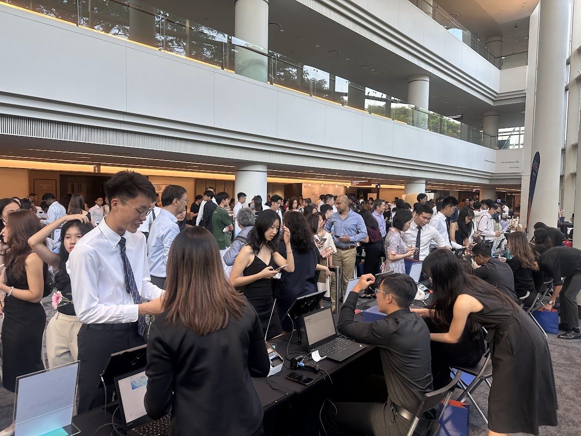Event attendees checking in at a busy onsite registration counter