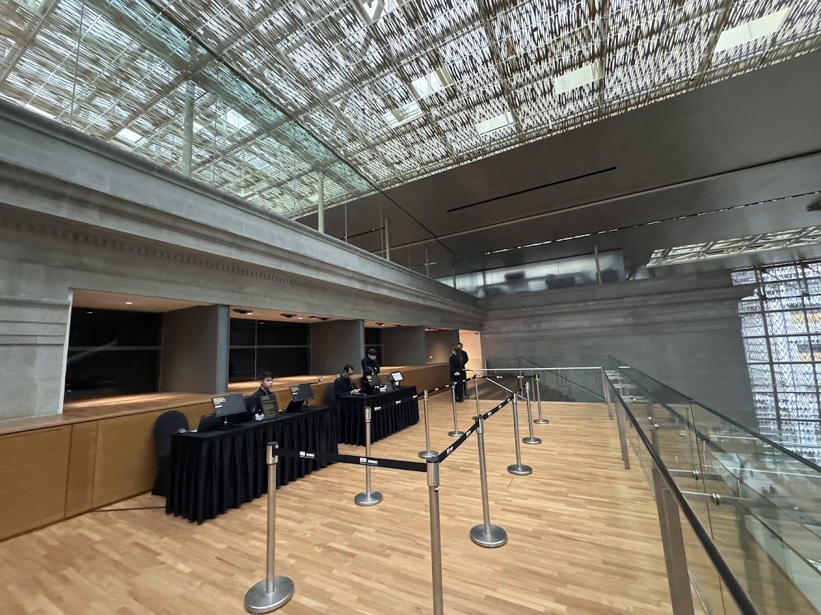 Quiet registration area with counters prepared for attendee arrivals